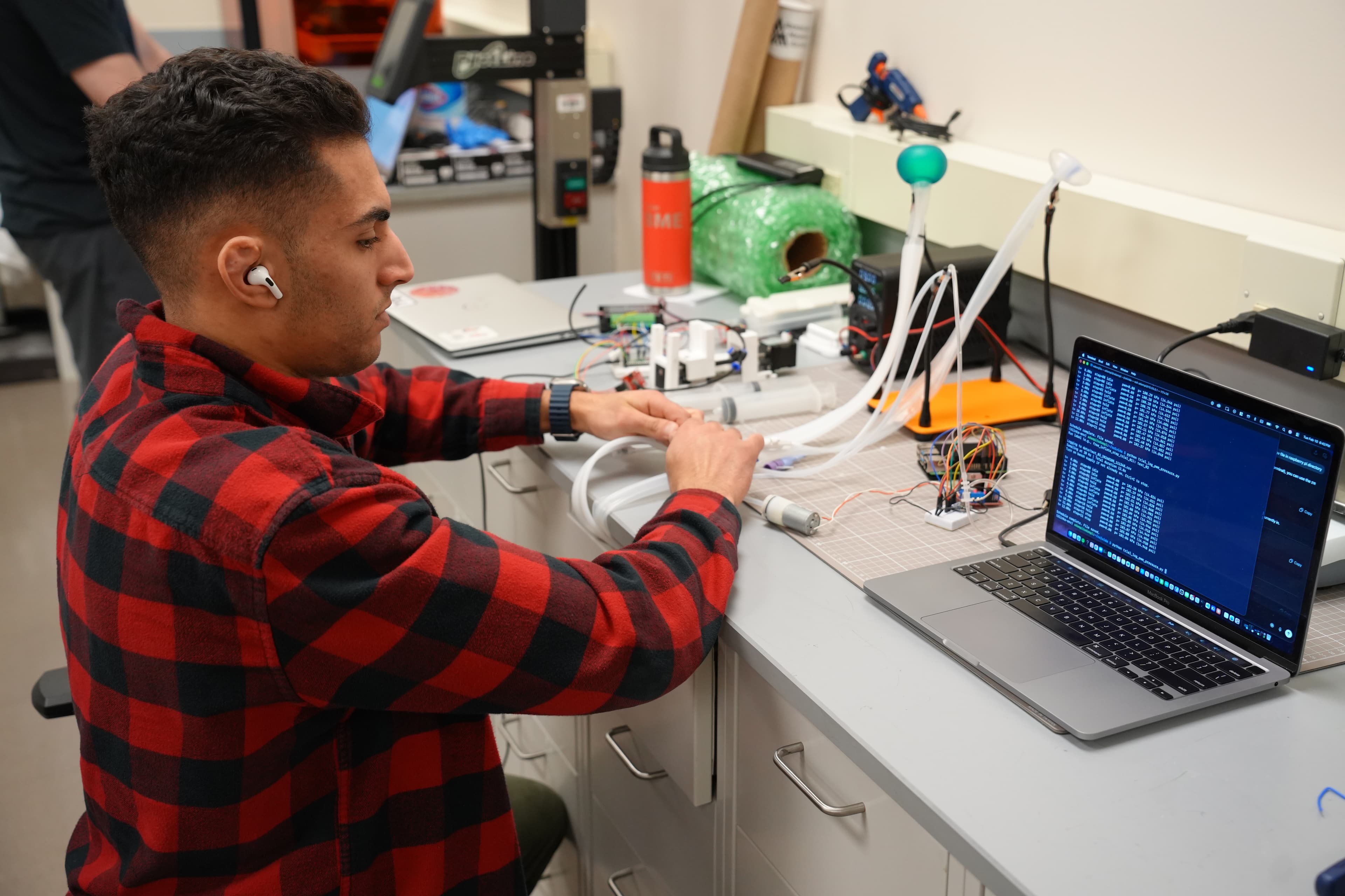 Student testing a hardware and software medical device prototype