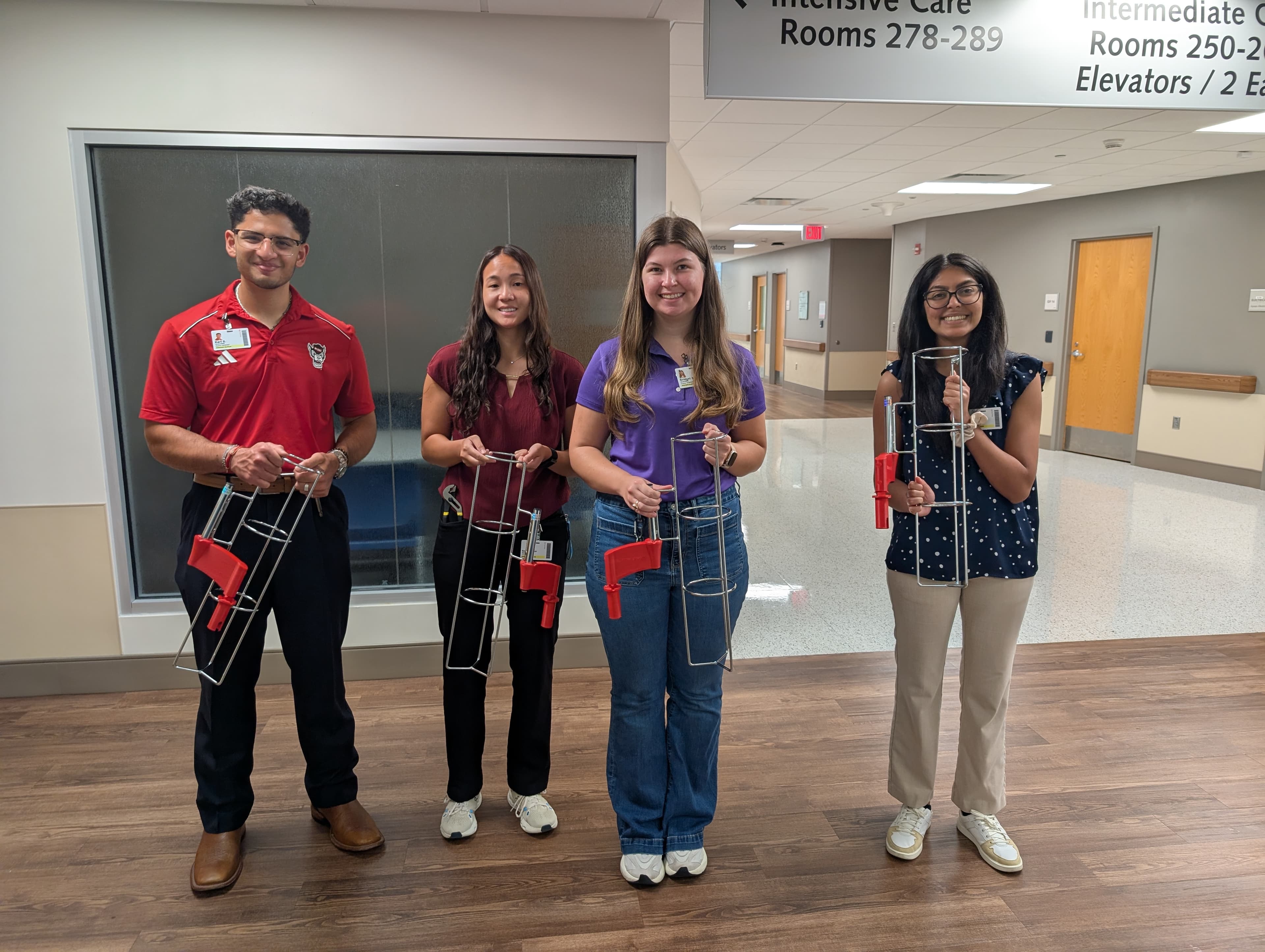 Students show an oxygen tank holder mounting system they designed, built and tested
