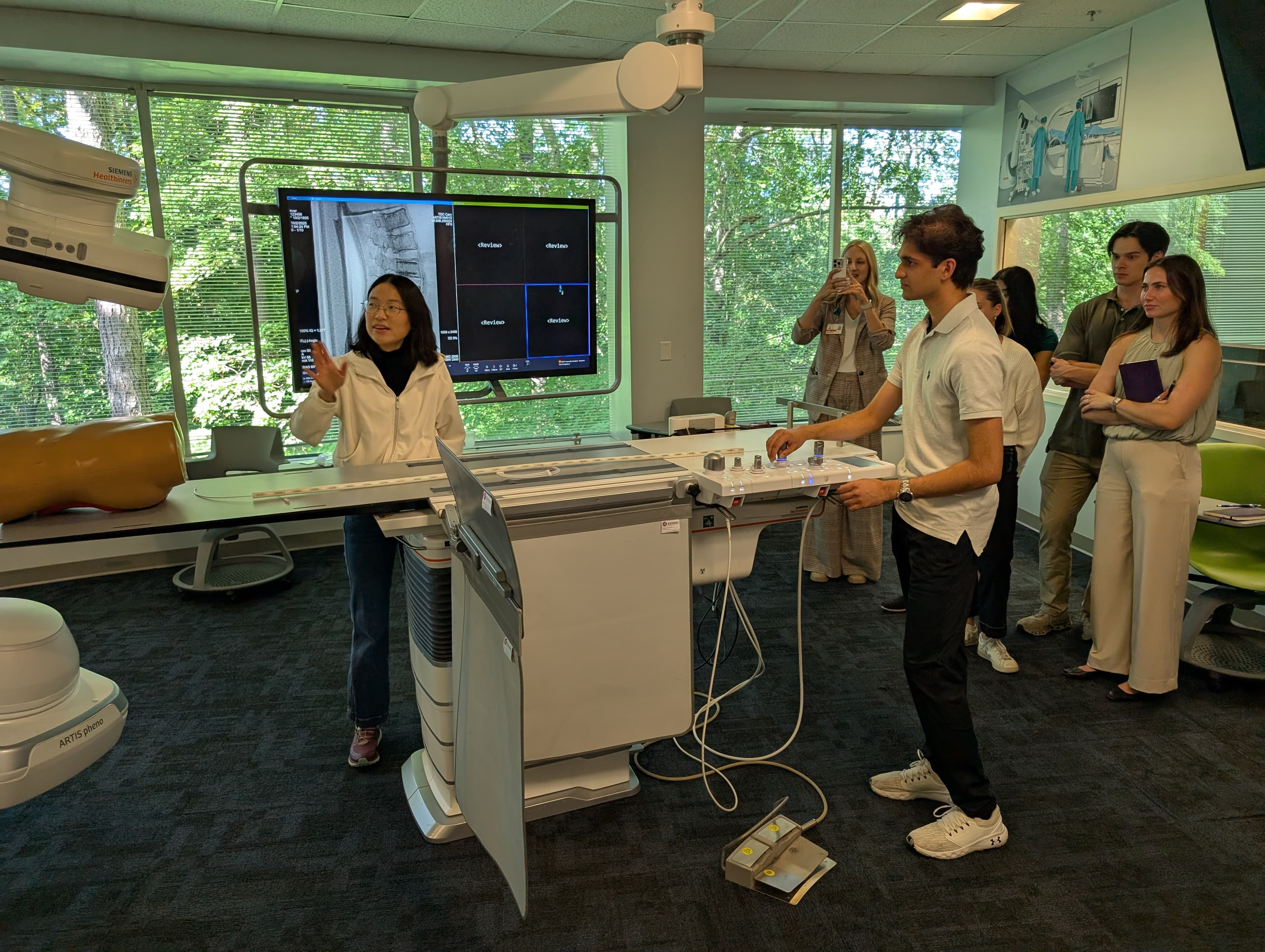 Student operates a large imaging machine at Siemens Healthineers Training Center